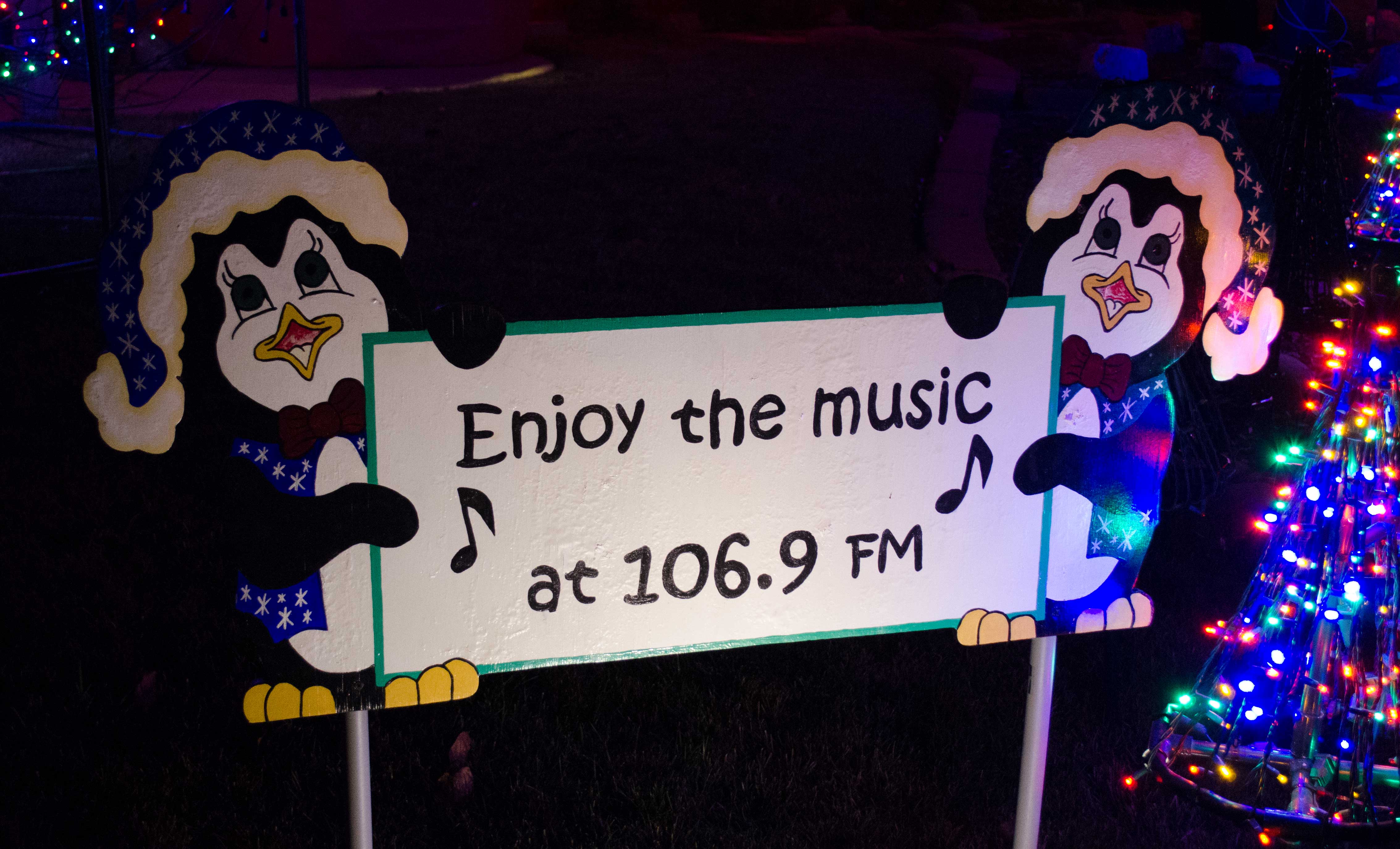 A picture showing the Penguins holding the music sign.